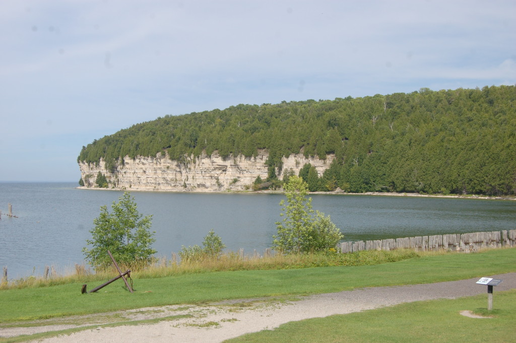A limestone cliff highlights the shoreline