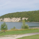 A limestone cliff highlights the shoreline