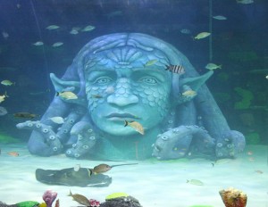 Statue in Water With Sea Life