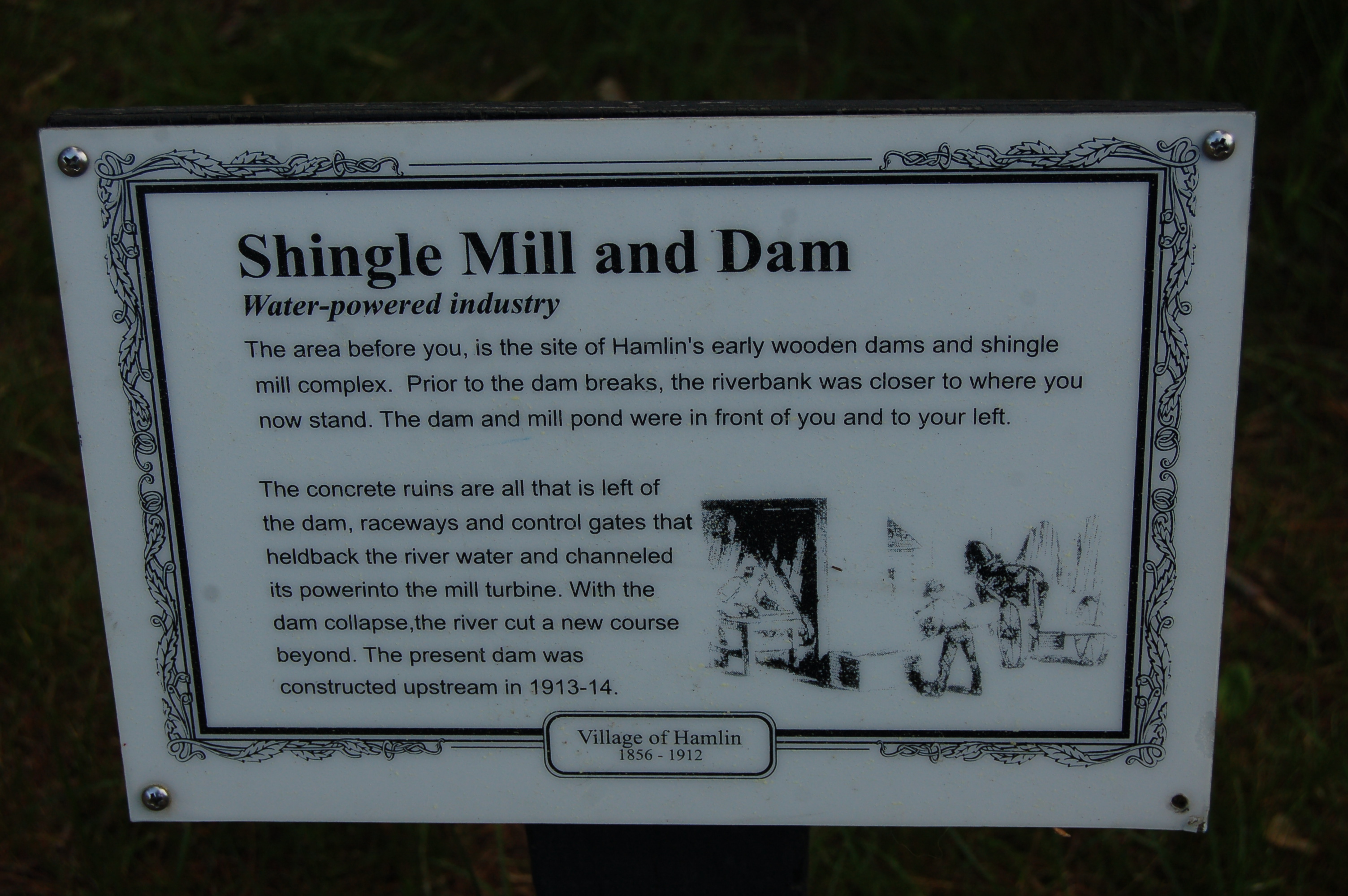 Interpretive signs along the paved pathway detail the area's rich lumber history