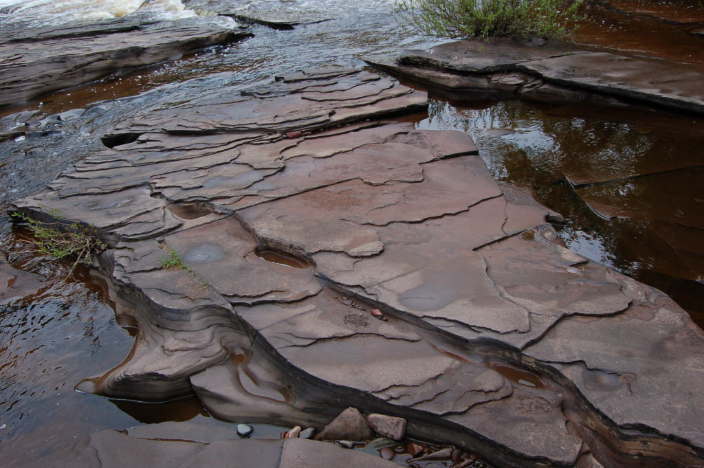 Layer of rock in the Presque Isle River